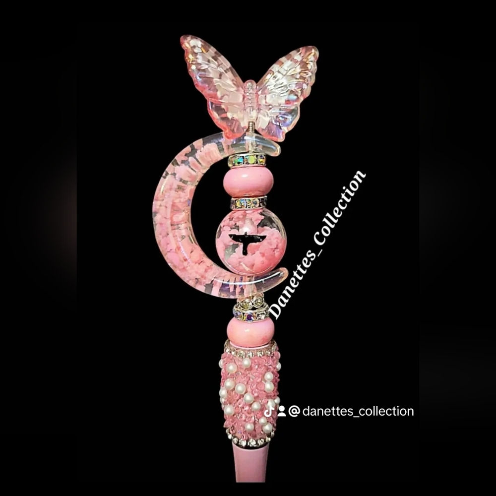 Pink butterfly with bird bead